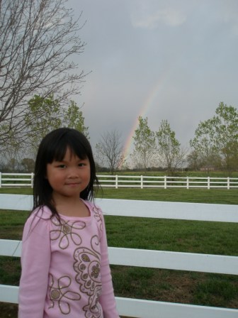 Kasen posing in front of the rainbow